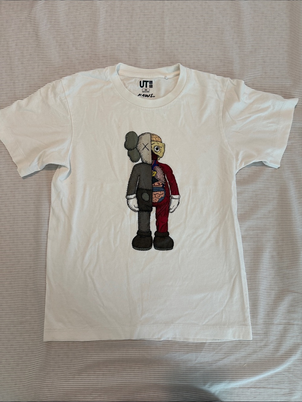 KAWS White Graphic T-Shirt with Multicolor Character Print
